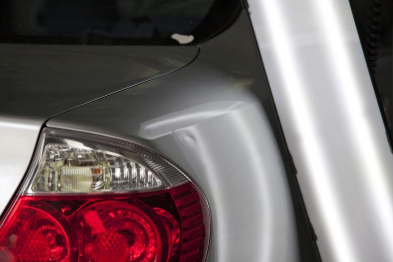 The lamp line bends around a tail light