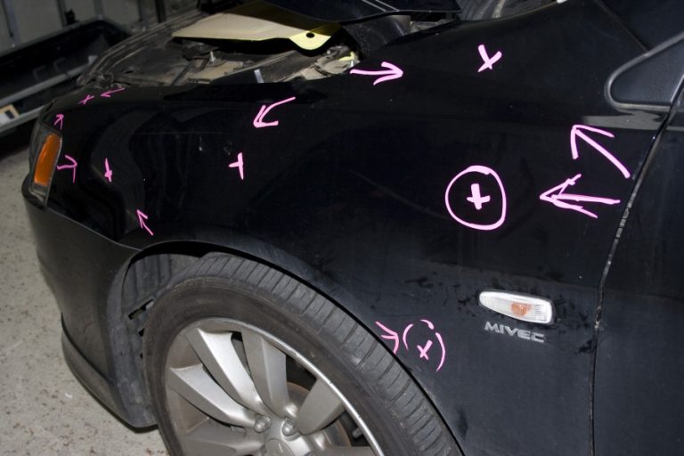 Hail dents marked on a bonnet and guard